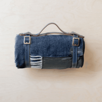 Image showing the Herringbone Recycled Wool Picnic Blanket with Brown Leather Carrier, 140 x 190cm, Navy product.