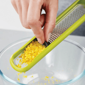 Image showing the Handi-Grate Zester with integrated blade wiper, Green product.