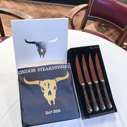 Image showing the Set of Steak Knives with Apron and Three Course Dining Experience and Cocktail for Two at Marco Pierre White's London Steakhouse Co product.