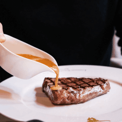 Image showing the Set of Steak Knives with Apron and Three Course Dining Experience and Cocktail for Two at Marco Pierre White's London Steakhouse Co product.